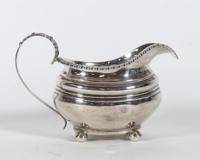 Lot 212 - A George IV silver cream jug, of bombe form,...