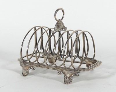 Lot 199 - A William IV silver toast rack, of canted...