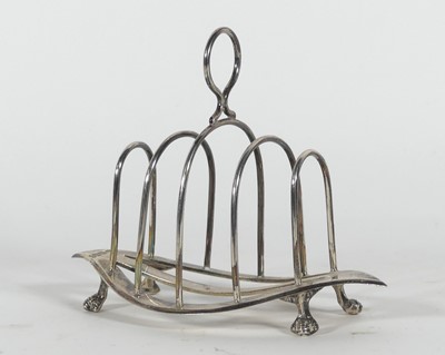 Lot 215 - An Edwardian silver toast rack, of elliptical...