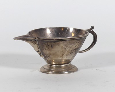 Lot 209 - A George VI silver cream jug, of conical form,...