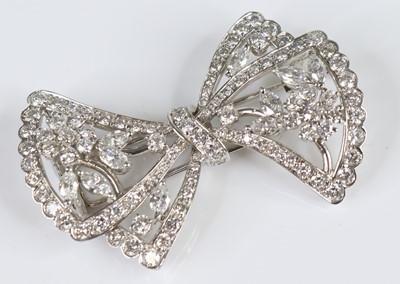 Lot 2670 - An Italian 18ct white gold diamond bow brooch,...