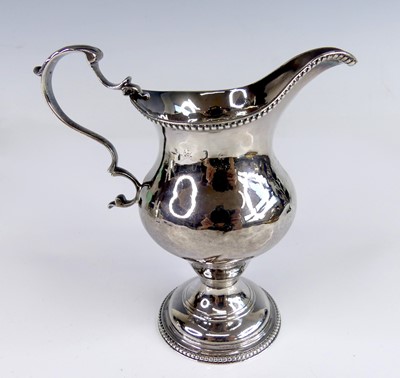 Lot 2117 - A George III silver pedestal cream jug, having...