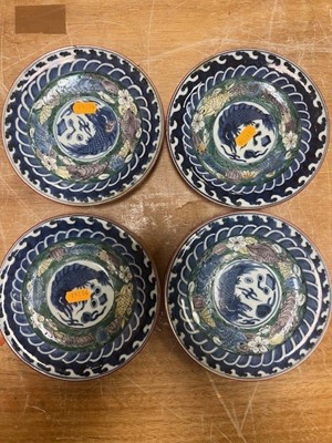 Lot 61 - A collection of nine Japanese polychrome...