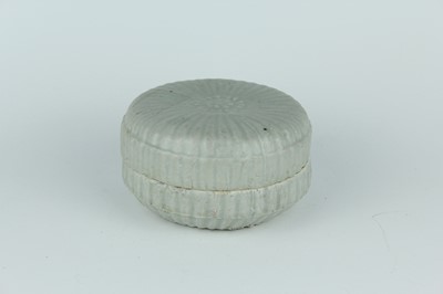 Lot 30 - A Chinese pale celadon-glazed box and cover,...