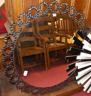 Lot 1130 - A contemporary circular wall mirror, with...