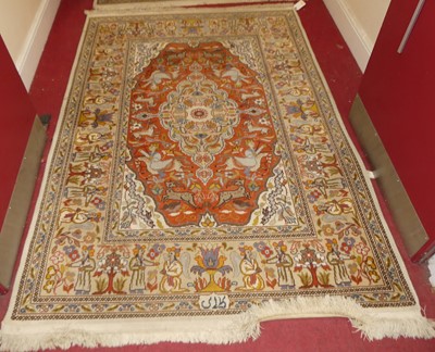 Lot 1187 - A near-pair of Persian woollen cream and rust...