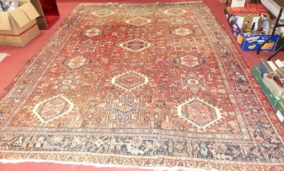 Lot 1188 - A large Persian red, cream and blue ground...