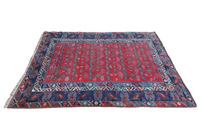 Lot 1189 - A large red, blue and cream ground Kazak...