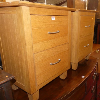 Lot 1395 - A pair of contemporary blond oak two drawer...