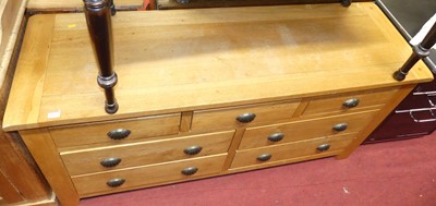 Lot 1415 - A contemporary blond oak side chest, fitted...