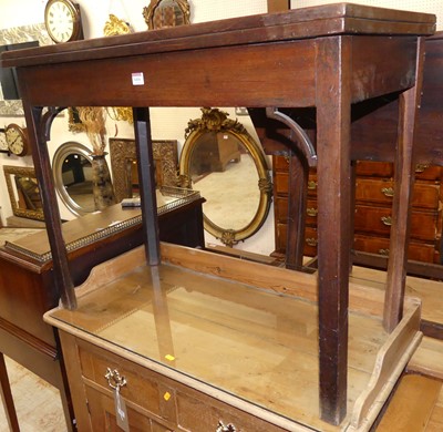 Lot 1416 - A George III mahogany fold-over tea table,...