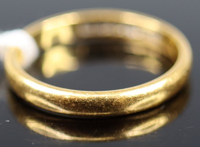Lot 348 - A 22ct gold  court shaped wedding band,...