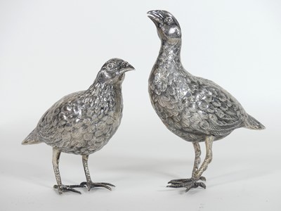 Lot 197 - A pair of white metal models of partridges,...