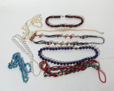 Lot 259 - A collection of beaded necklaces, to include...
