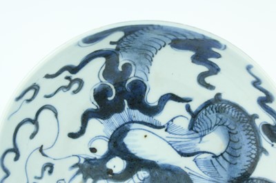 Lot 10 - A Chinese blue and white ‘dragon’ dish, Qing...