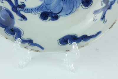 Lot 10 - A Chinese blue and white ‘dragon’ dish, Qing...