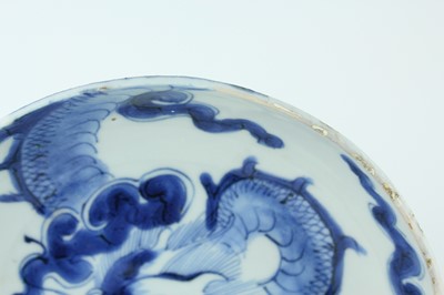 Lot 10 - A Chinese blue and white ‘dragon’ dish, Qing...