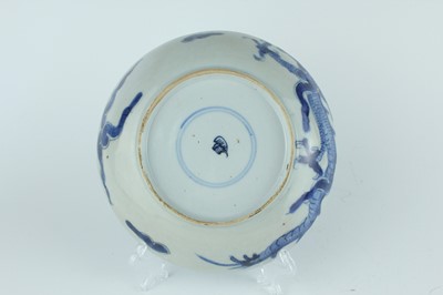 Lot 10 - A Chinese blue and white ‘dragon’ dish, Qing...