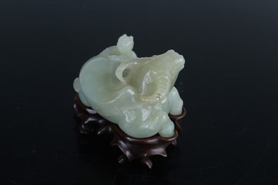 Lot 38 - A Chinese pale celadon jade figure of a water...