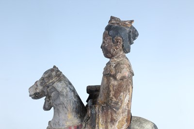 Lot 45 - A Chinese painted wooden figure of a rider on...