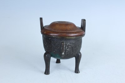 Lot 69 - Two Chinese bronze tripod censers, Qing...