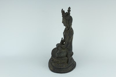Lot 67 - A Chinese bronze figure of Buddha seated on a...
