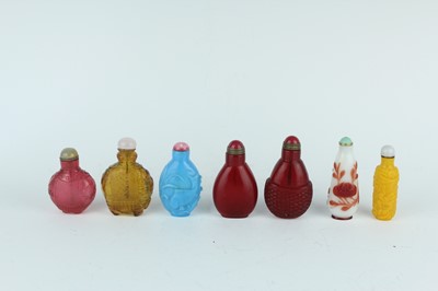 Lot 29 - A group of seven Chinese glass snuff bottles,...