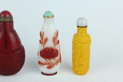 Lot 29 - A group of seven Chinese glass snuff bottles,...