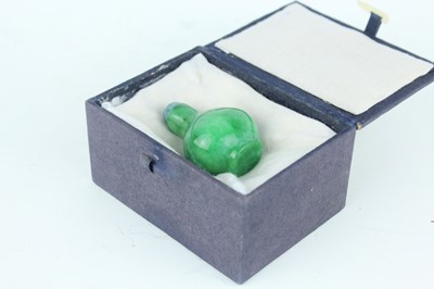 Lot 34 - A Chinese jadeite snuff bottle, 20th century...