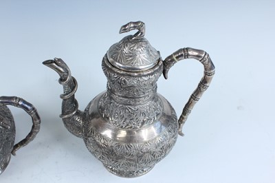 Lot 159 - A set of four Chinese export silver tea sets,...