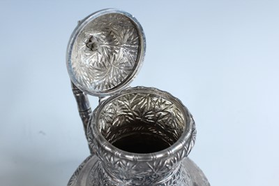 Lot 159 - A set of four Chinese export silver tea sets,...