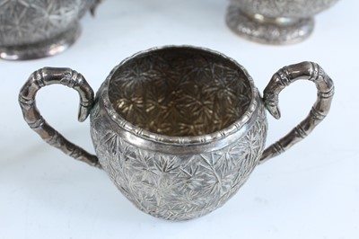 Lot 159 - A set of four Chinese export silver tea sets,...