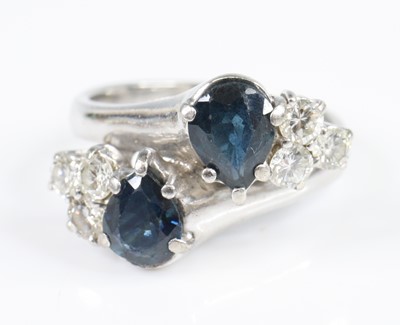Lot 2268 - A white metal sapphire and diamond crossover...
