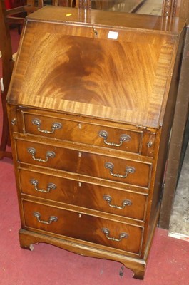 Lot 1160 - A contemporary mahogany narrow slopefront four...