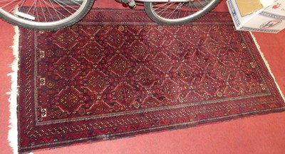 Lot 1171 - A Persian red and deep blue ground woollen...