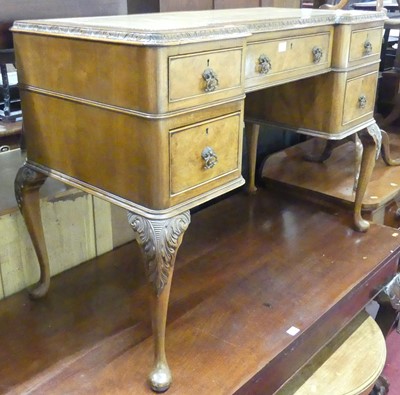 Lot 1310 - A figured walnut and a gilt tooled leather...