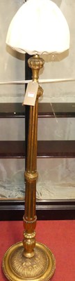 Lot 1316 - A giltwood turned floral decorated and fluted...