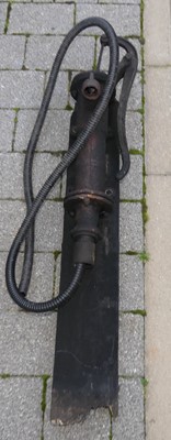 Lot 1439 - A cast iron water pump on wood backing