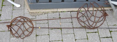 Lot 1440 - A pair of metal sphere plant supports, each...