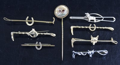 Lot 867 - A gilt metal stick pin, the terminal enamel...