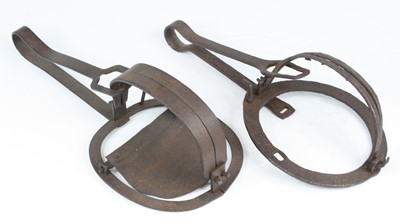 Lot 871 - A 19th century iron trap, having 7" rounded...