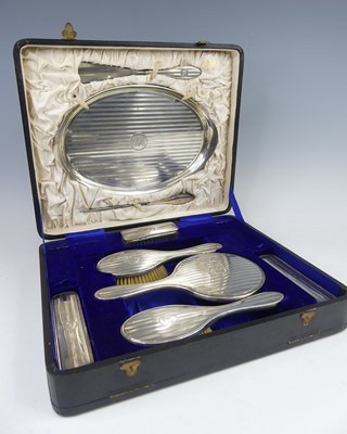 Lot 2200 - A George V silver lady's dressing table set in...