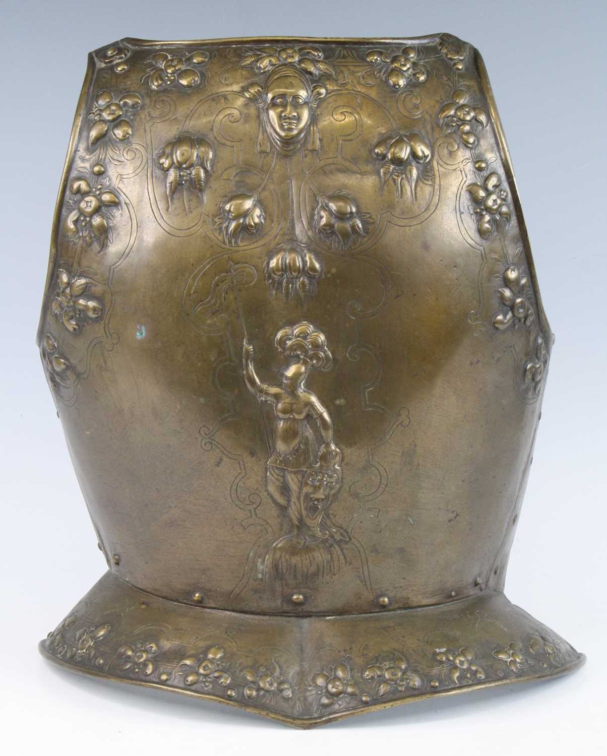 Lot 91 - A decorative cast brass breast plate, embossed...