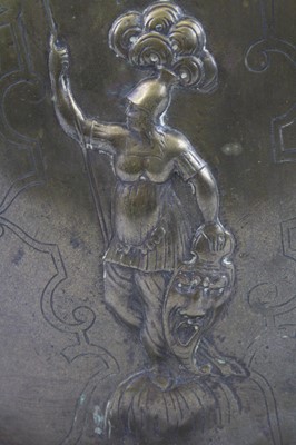 Lot 91 - A decorative cast brass breast plate, embossed...