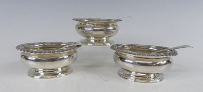 Lot 2197 - A set of three George III silver table salts...