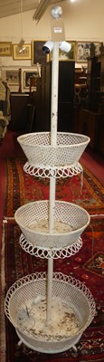 Lot 1221 - A painted and pierced metal graduated...