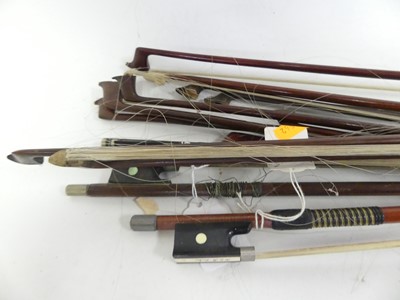 Lot 572 - A collection of violin bows