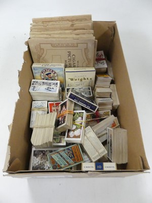 Lot 581 - A collection of cigarette cards, to include...