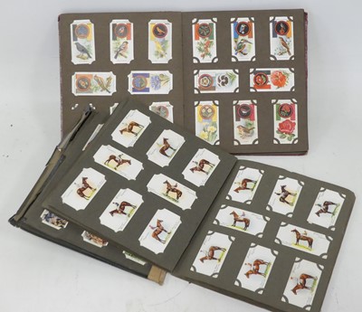 Lot 537 - A collection of cigarette cards, to include...