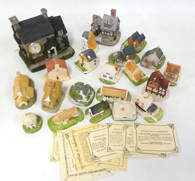 Lot 547 - A collection of model cottages, to include The...
